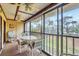 Enclosed patio with seating and tranquil view at 4260 Placida Rd # 18C, Englewood, FL 34224