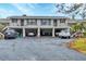 Condo building with covered parking and balconies at 4260 Placida Rd # 18C, Englewood, FL 34224