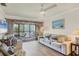 Living room with sofa, chairs, and access to balcony at 4260 Placida Rd # 18C, Englewood, FL 34224