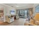 Living room with comfy seating and a view of a balcony at 4260 Placida Rd # 18C, Englewood, FL 34224