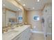 Spa-like bathroom with double sinks, white cabinets, and a glass shower at 5000 Gasparilla Rd # 26A, Boca Grande, FL 33921