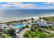 Aerial view of beachfront property with pool and ocean view at 5000 Gasparilla Rd # Dc307, Boca Grande, FL 33921