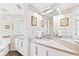 Bathroom with unique wallpaper and a double vanity at 5000 Gasparilla Rd # Dc307, Boca Grande, FL 33921