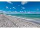 Beautiful white sand beach with ocean waves at 5000 Gasparilla Rd # Dc307, Boca Grande, FL 33921