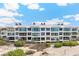 Beachfront building exterior, featuring modern design and large windows at 5000 Gasparilla Rd # Dc307, Boca Grande, FL 33921