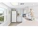 White kitchen with stainless steel appliances and ocean view at 5000 Gasparilla Rd # Dc307, Boca Grande, FL 33921