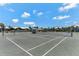 Well-maintained tennis court with seating area at 5000 Gasparilla Rd # Dc307, Boca Grande, FL 33921