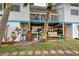 Landscaped backyard with storage and parking area at 5031 N Beach Rd # 112, Englewood, FL 34223