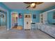 Bedroom with built-in shelving, white cabinet, and access to bathroom at 5031 N Beach Rd # 112, Englewood, FL 34223