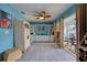 Bedroom with built-in bed, access to patio, and light wood flooring at 5031 N Beach Rd # 112, Englewood, FL 34223