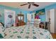 Coastal-themed bedroom with a metal bed frame and ensuite bathroom at 5031 N Beach Rd # 112, Englewood, FL 34223