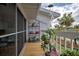 Deck with potted plants, and view of surrounding area at 5031 N Beach Rd # 112, Englewood, FL 34223