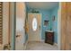 Bright entryway with blue walls, unique decor, and wood flooring at 5031 N Beach Rd # 112, Englewood, FL 34223