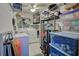 Laundry room with washer, dryer, and ample storage shelves at 5031 N Beach Rd # 112, Englewood, FL 34223