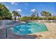 Community pool with lounge chairs at 5319 Shagbark Ct, North Port, FL 34287