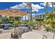 Relaxing outdoor patio with grills and seating near a water feature at 5700 Gulf Shores Dr # B234, Boca Grande, FL 33921