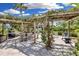 Outdoor grilling area with pergola and ample seating at 5700 Gulf Shores Dr # B234, Boca Grande, FL 33921