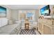 Small bedroom with daybed, dresser, and ocean view at 5700 Gulf Shores Dr # B234, Boca Grande, FL 33921