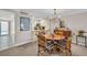 Charming dining area with wicker chairs and round table at 5700 Gulf Shores Dr # B234, Boca Grande, FL 33921