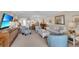 Bright and airy living room with comfortable seating and large TV at 5700 Gulf Shores Dr # B234, Boca Grande, FL 33921