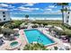 Aerial view of resort-style pool, spa, and beach access at 5700 Gulf Shores Dr # B234, Boca Grande, FL 33921
