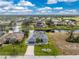 Aerial view of single story house and surrounding neighborhood at 60 White Marsh Ln, Rotonda West, FL 33947