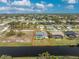 Aerial view of a single Gathering home with pool and canal views at 60 White Marsh Ln, Rotonda West, FL 33947