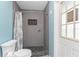 Bathroom with walk-in shower and tiled floors at 60 White Marsh Ln, Rotonda West, FL 33947