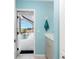 Small bathroom with pool view at 60 White Marsh Ln, Rotonda West, FL 33947