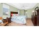 King-size bed, wood furniture, and pool access at 60 White Marsh Ln, Rotonda West, FL 33947