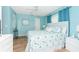 Bright bedroom with king bed and ocean decor at 60 White Marsh Ln, Rotonda West, FL 33947