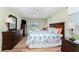 Spacious bedroom with king-size bed and pool view at 60 White Marsh Ln, Rotonda West, FL 33947