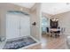 Entryway with double doors and view into dining area with light wood table at 60 White Marsh Ln, Rotonda West, FL 33947