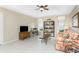 Gathering room with comfortable sofa and built-in shelving at 60 White Marsh Ln, Rotonda West, FL 33947