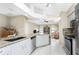 Open kitchen with granite countertops and stainless steel appliances at 60 White Marsh Ln, Rotonda West, FL 33947