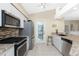 Updated kitchen featuring stainless steel appliances and granite countertops at 60 White Marsh Ln, Rotonda West, FL 33947