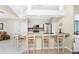 Kitchen with granite countertops, stainless steel appliances, and breakfast bar at 60 White Marsh Ln, Rotonda West, FL 33947