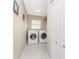 Laundry room with washer, dryer, and tile floor at 60 White Marsh Ln, Rotonda West, FL 33947