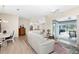 Spacious living room with off-white sectional and access to pool area at 60 White Marsh Ln, Rotonda West, FL 33947