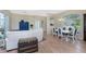 Bright living room features white couch and access to the lanai and pool at 60 White Marsh Ln, Rotonda West, FL 33947