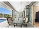 Covered patio with outdoor dining and pool view at 60 White Marsh Ln, Rotonda West, FL 33947