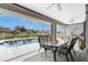 Enclosed pool area with table and chairs at 60 White Marsh Ln, Rotonda West, FL 33947