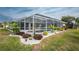 Relaxing pool area with lush landscaping, offering a private oasis at 60 White Marsh Ln, Rotonda West, FL 33947