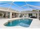 Relaxing kidney-shaped pool with screened enclosure at 60 White Marsh Ln, Rotonda West, FL 33947