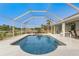 Inviting kidney-shaped pool with screened enclosure at 60 White Marsh Ln, Rotonda West, FL 33947