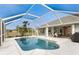Inviting pool and lanai with screened enclosure, offering ample space for relaxation and entertainment at 60 White Marsh Ln, Rotonda West, FL 33947