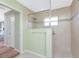 Walk-in shower with tiled walls and glass enclosure at 60 White Marsh Ln, Rotonda West, FL 33947