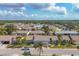 Aerial view of Foxwood community showcasing numerous houses and landscaping at 610 Apple Ln, Englewood, FL 34223