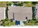 Top-down view showcasing the home's layout and surrounding landscape at 610 Apple Ln, Englewood, FL 34223