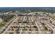 Aerial view of a residential community with single-Gathering homes at 610 Apple Ln, Englewood, FL 34223